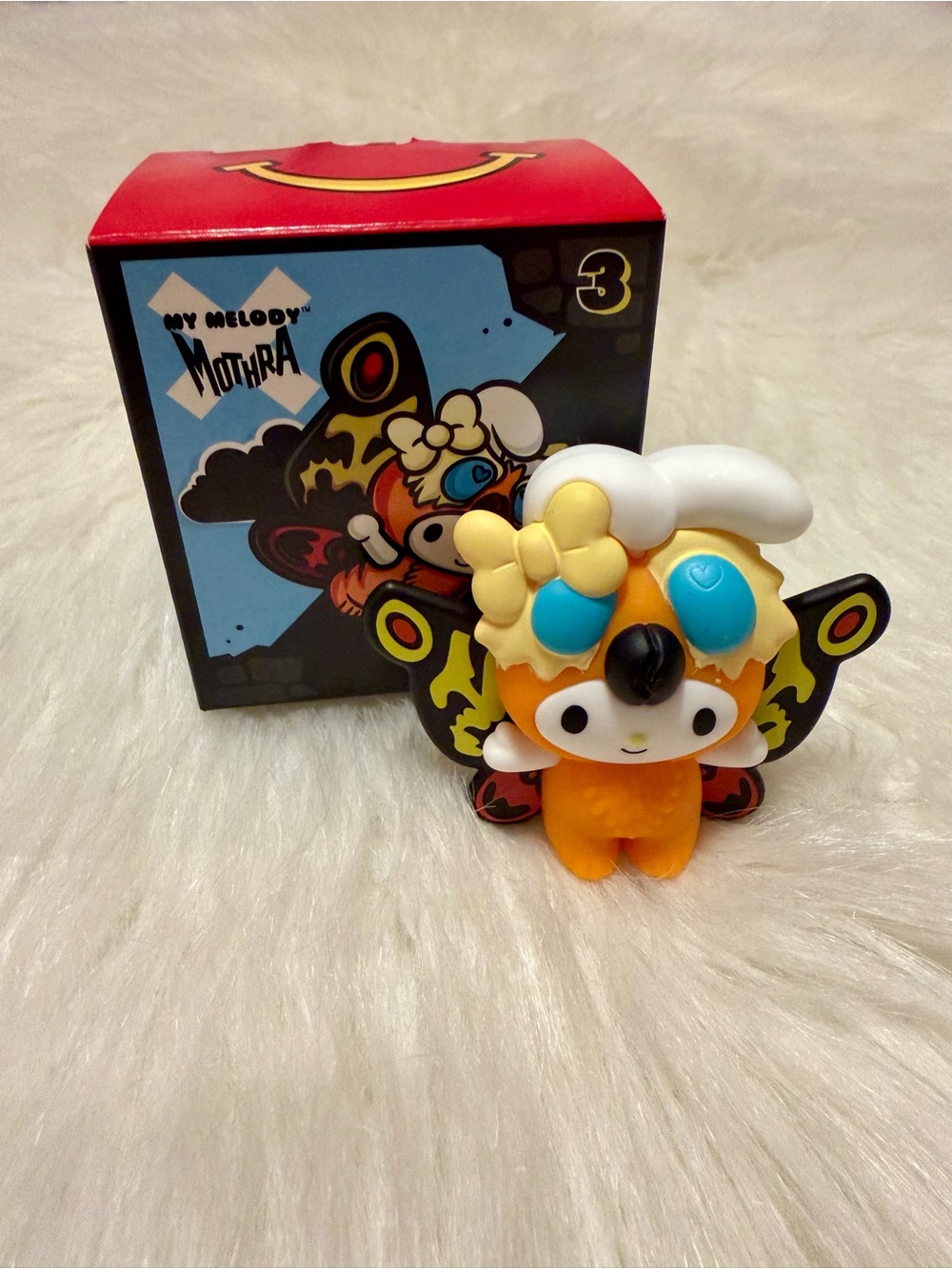 McDonald's My Melody Mothra Orange Vinyl Figure with Blue Accents